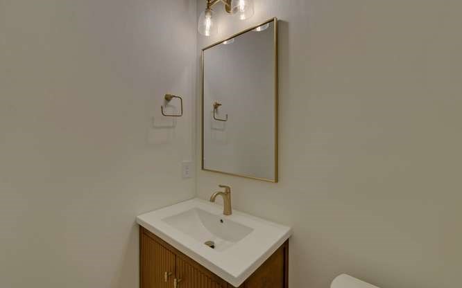 317 Bell Creek Cove Road Hiawassee, GA 30546 - Photo 31 of 74 a bathroom with a sink and a mirror