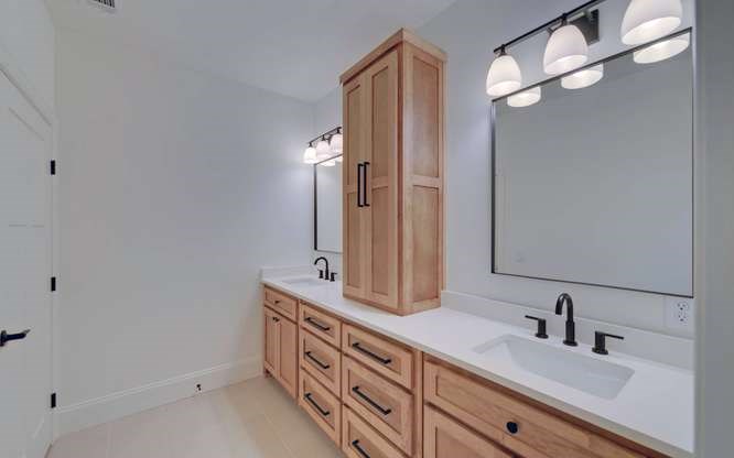 317 Bell Creek Cove Road Hiawassee, GA 30546 - Photo 39 of 74 a bathroom with a double vanity sink and a mirror