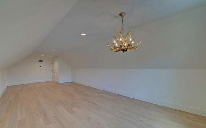 317 Bell Creek Cove Road Hiawassee, GA 30546 - Photo 45 of 74 a view of wooden floor and chandelier in living room