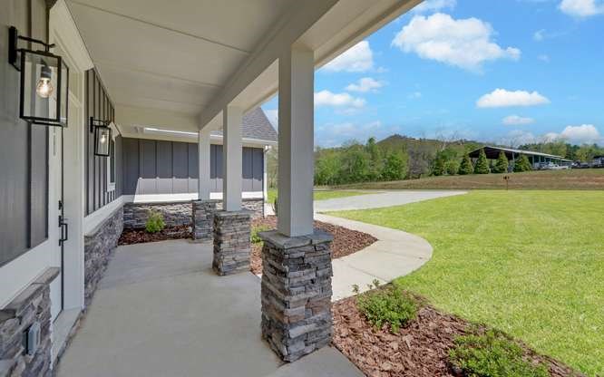 317 Bell Creek Cove Road Hiawassee, GA 30546 - Photo 5 of 74 a view of a patio with chairs and table