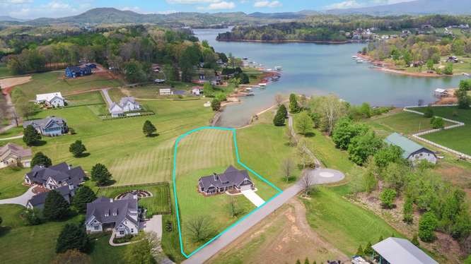317 Bell Creek Cove Road Hiawassee, GA 30546 - Photo 65 of 74 an aerial view of a house with a garden and lake view
