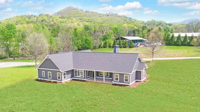 317 Bell Creek Cove Road Hiawassee, GA 30546 - Photo 67 of 74 an aerial view of residential houses with outdoor space and trees