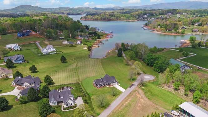 317 Bell Creek Cove Road Hiawassee, GA 30546 - Photo 68 of 74 an aerial view of lake residential house with swimming pool and mountain view
