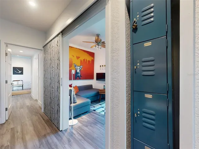 a view of room with window and wooden floor