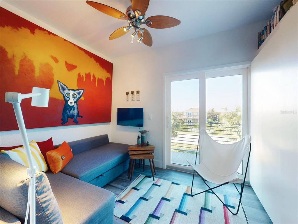 901 Sheepshead Avenue New Smyrna Beach, FL 32169 - Photo 13 of 64 a living room with furniture and a window