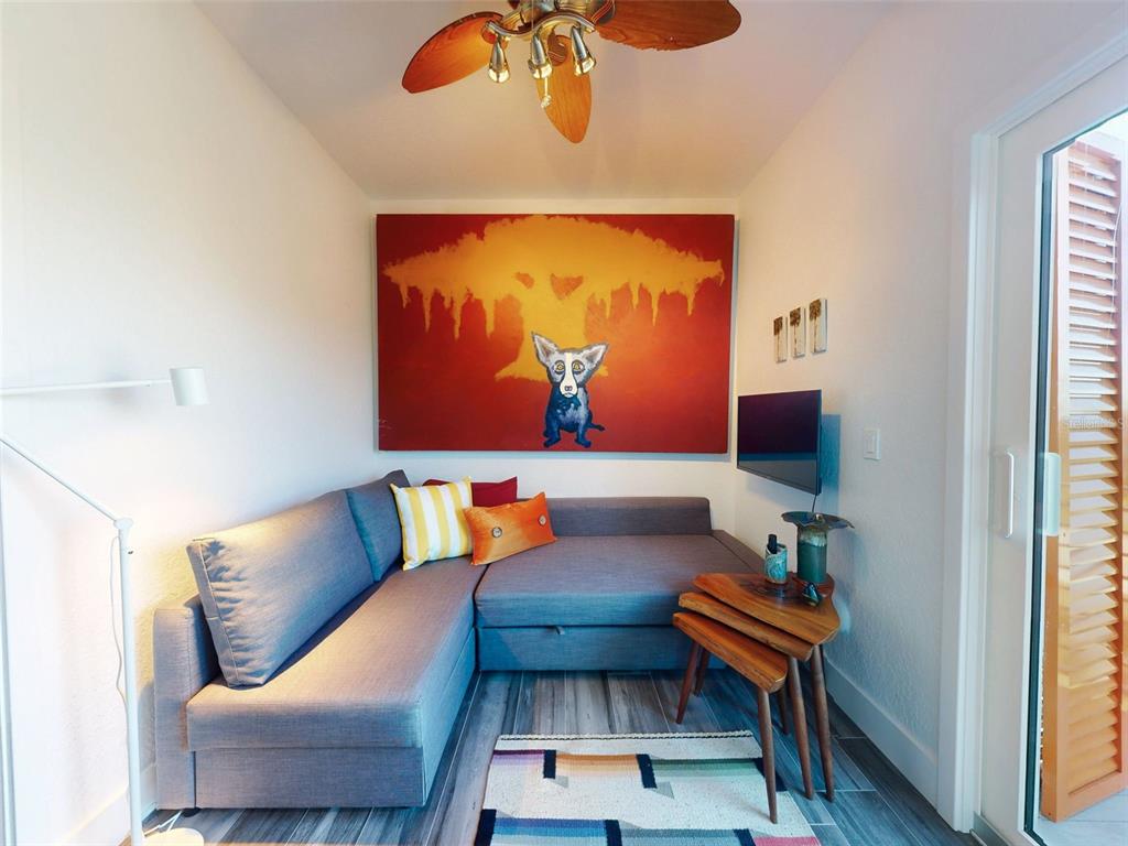 901 Sheepshead Avenue New Smyrna Beach, FL 32169 - Photo 14 of 64 a living room with furniture and a window
