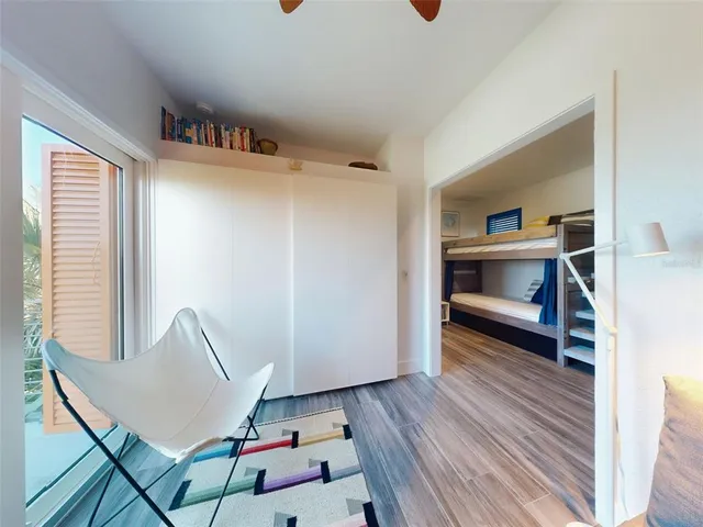 a bathroom with a sink and a painting on the wall