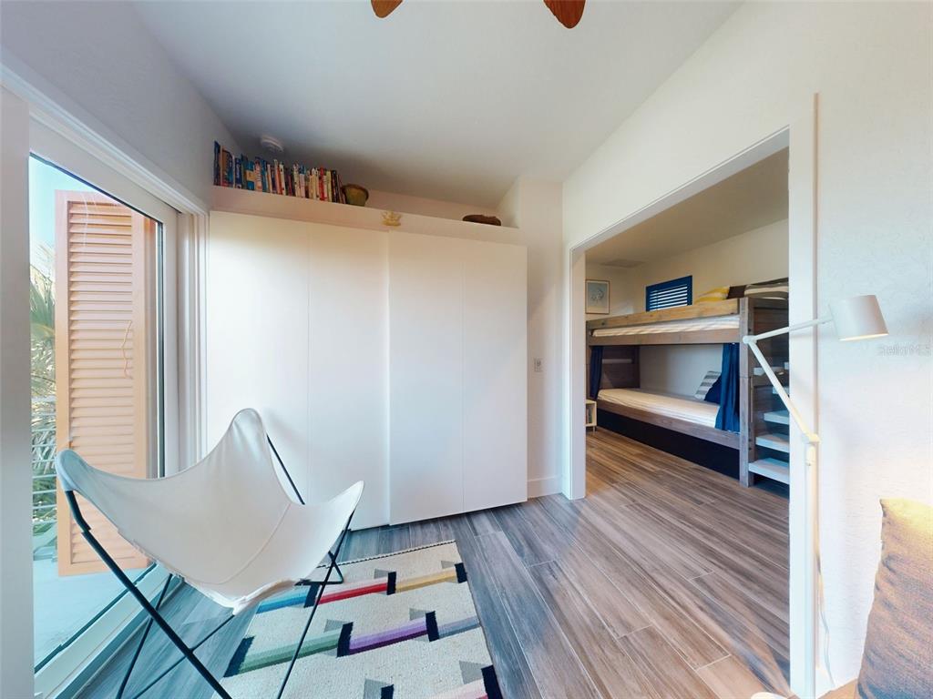901 Sheepshead Avenue New Smyrna Beach, FL 32169 - Photo 15 of 64 a view of room with window and wooden floor