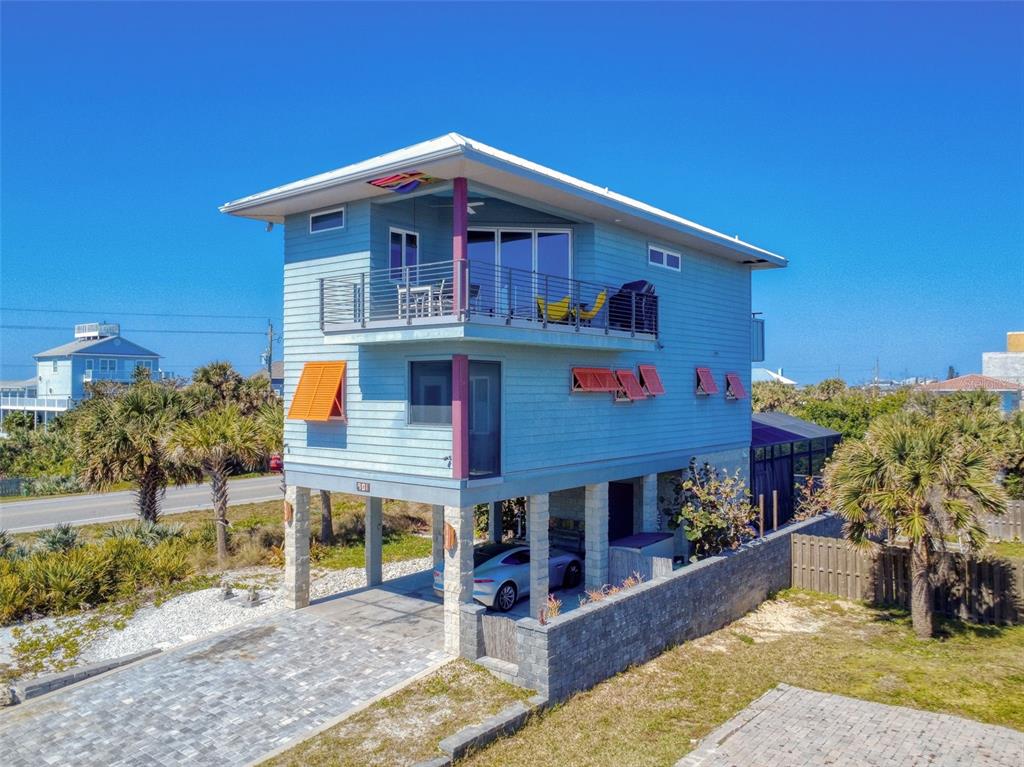 901 Sheepshead Avenue New Smyrna Beach, FL 32169 - Photo 2 of 64 a front view of a house with a yard