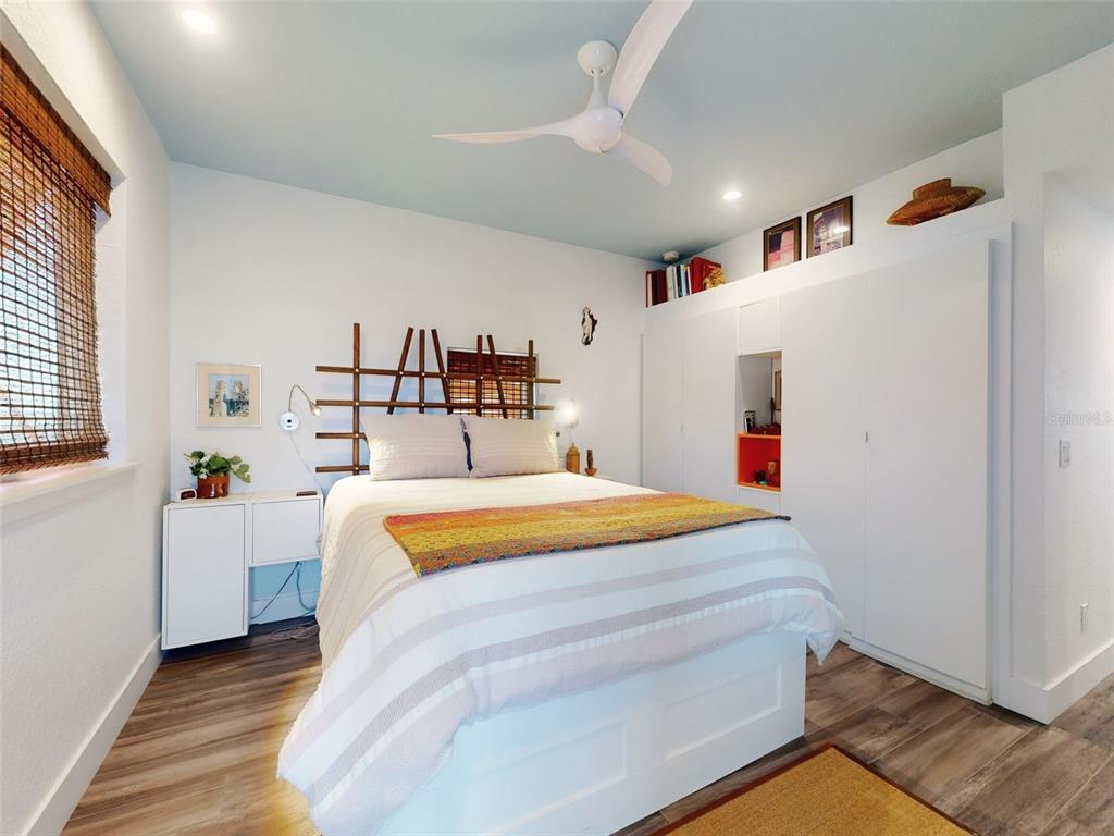 901 Sheepshead Avenue New Smyrna Beach, FL 32169 - Photo 21 of 64 a bedroom with a bed and a window