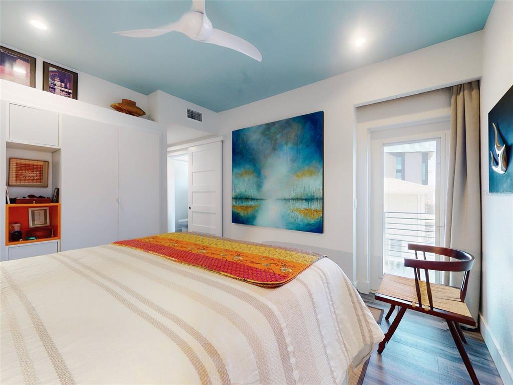 901 Sheepshead Avenue New Smyrna Beach, FL 32169 - Photo 22 of 64 a bedroom with a bed and a flat screen tv