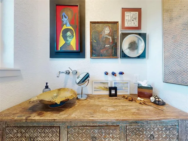 a very nice looking room with many windows and a chandelier