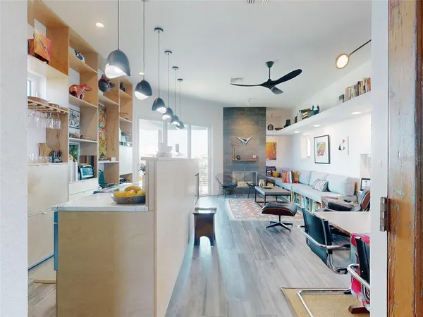 a kitchen with a two sinks a large window and a counter space
