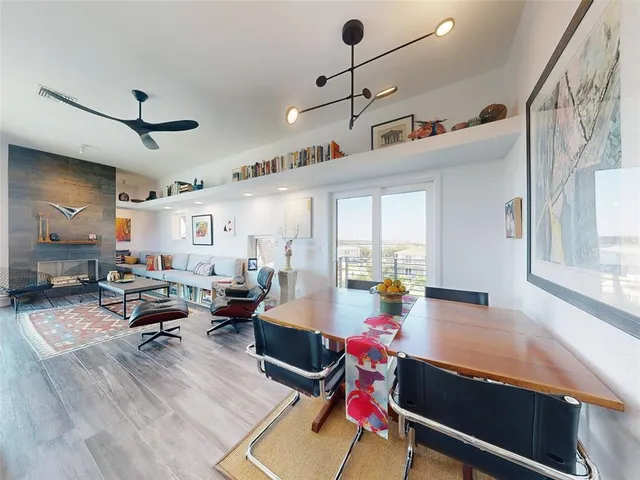 a view of a room with workspace and wooden floor