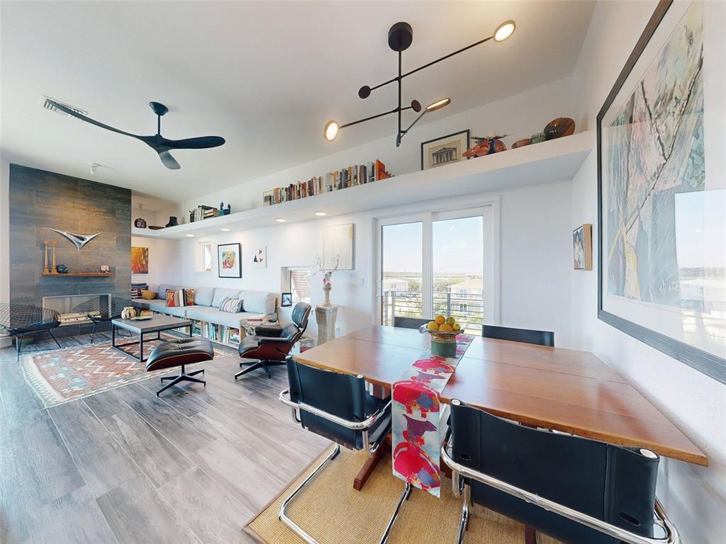 901 Sheepshead Avenue New Smyrna Beach, FL 32169 - Photo 28 of 64 a living room with furniture gym equipment and a large window
