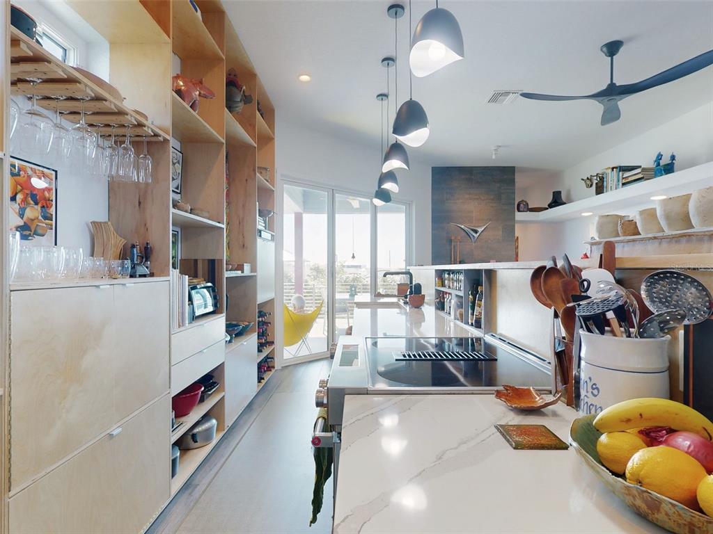 901 Sheepshead Avenue New Smyrna Beach, FL 32169 - Photo 30 of 64 a very nice looking room with many windows and a chandelier