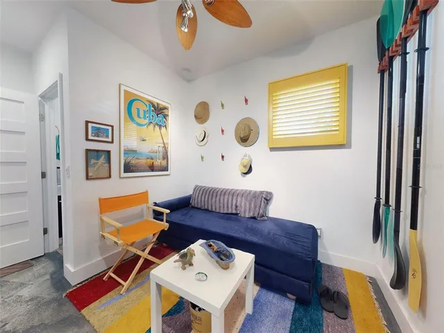 a living room with furniture and a gate