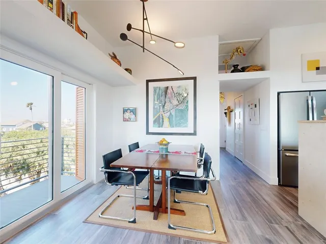 a living room with furniture flat screen tv and a fireplace