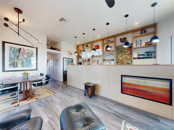 a bedroom with a bed and book shelf