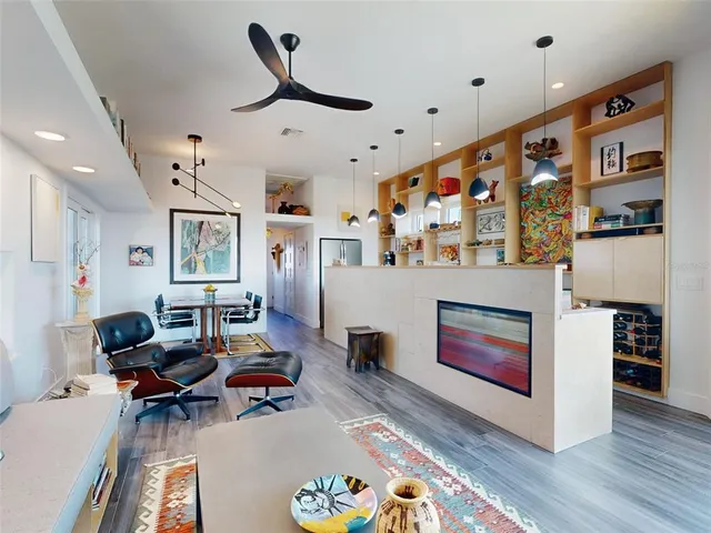 a hallway with a dining table and chairs
