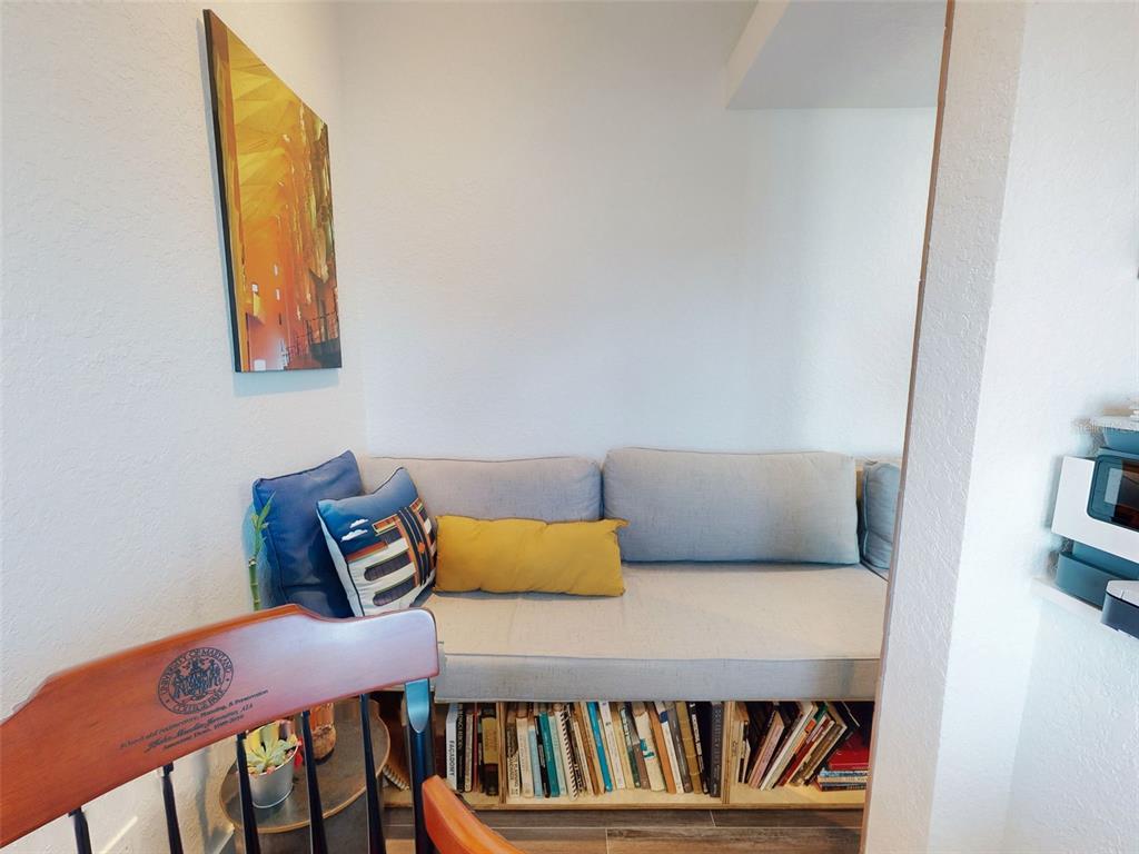 901 Sheepshead Avenue New Smyrna Beach, FL 32169 - Photo 46 of 64 a bedroom with a bed and book shelf