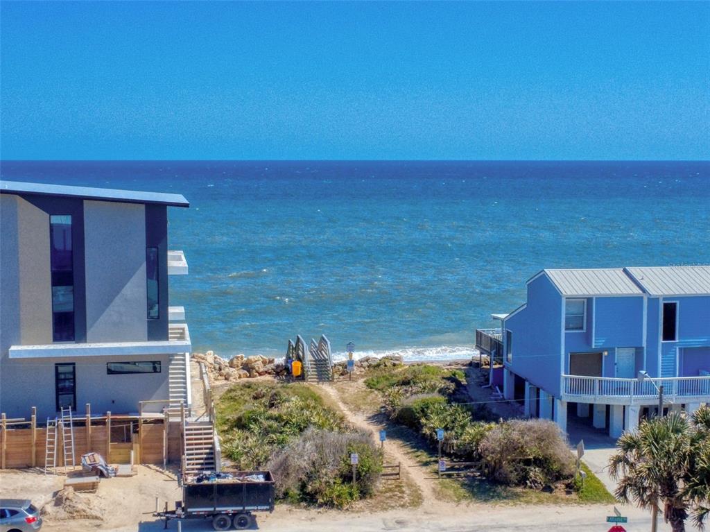 901 Sheepshead Avenue New Smyrna Beach, FL 32169 - Photo 62 of 64 a view of a lake with a building in front of it