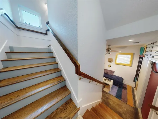 a bedroom with a bed and a mirror