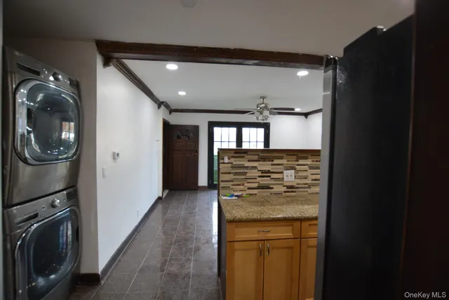 a view of a kitchen with a washer and dryer