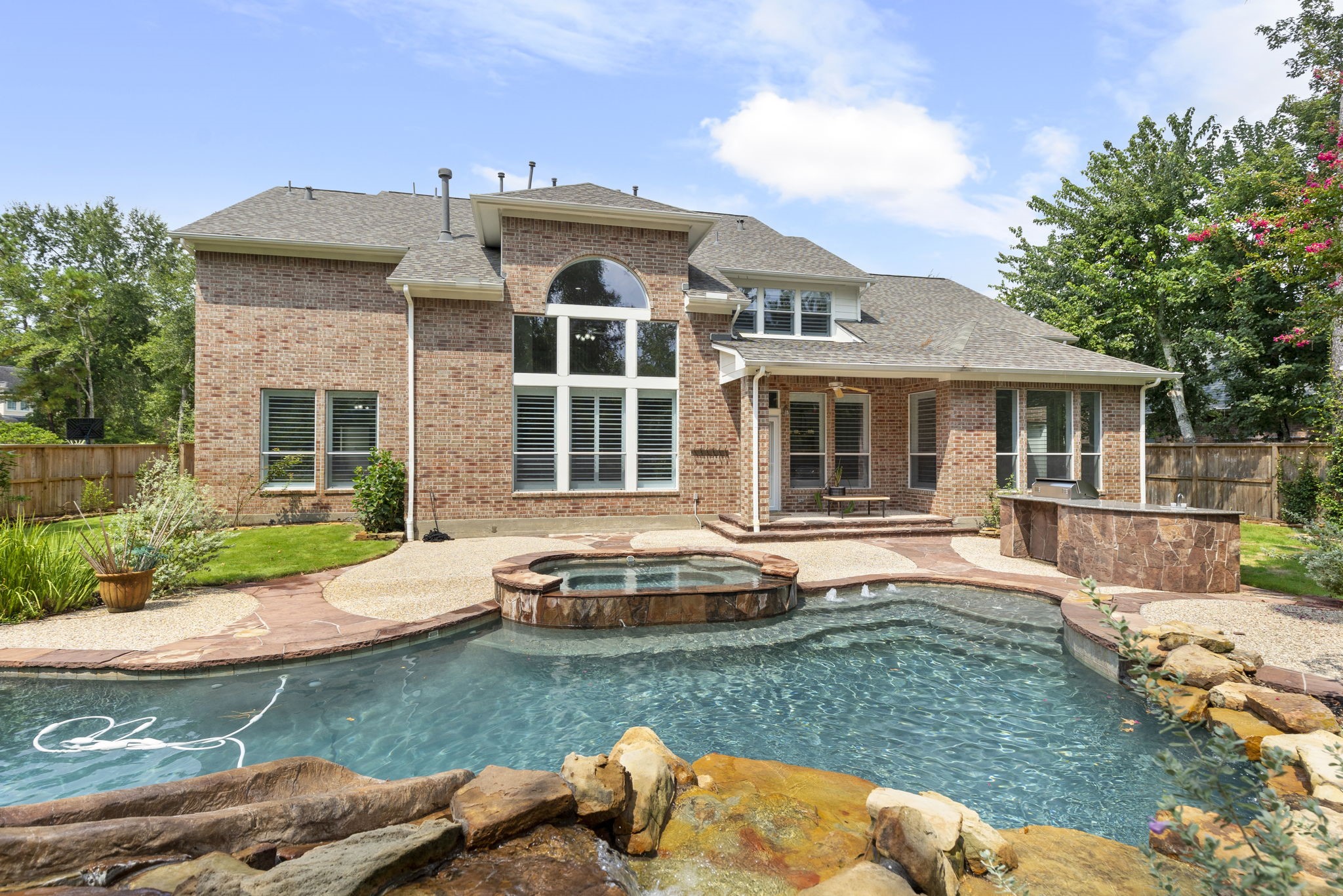 6 Skipwith Place Spring, TX 77382 - Photo 1 of 44 a front view of a house with a yard