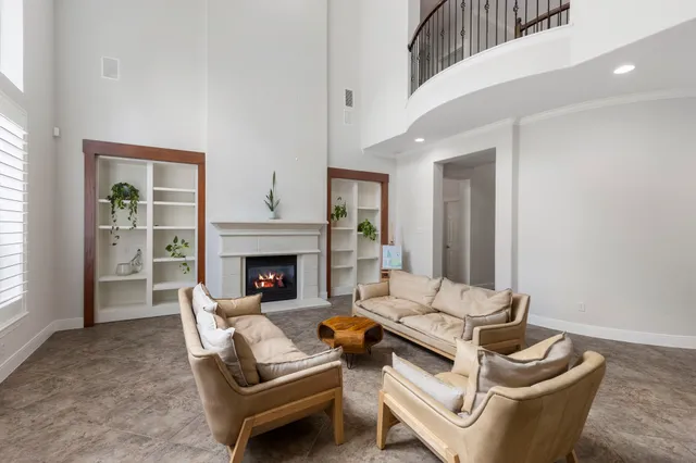 a living room with furniture and a fireplace