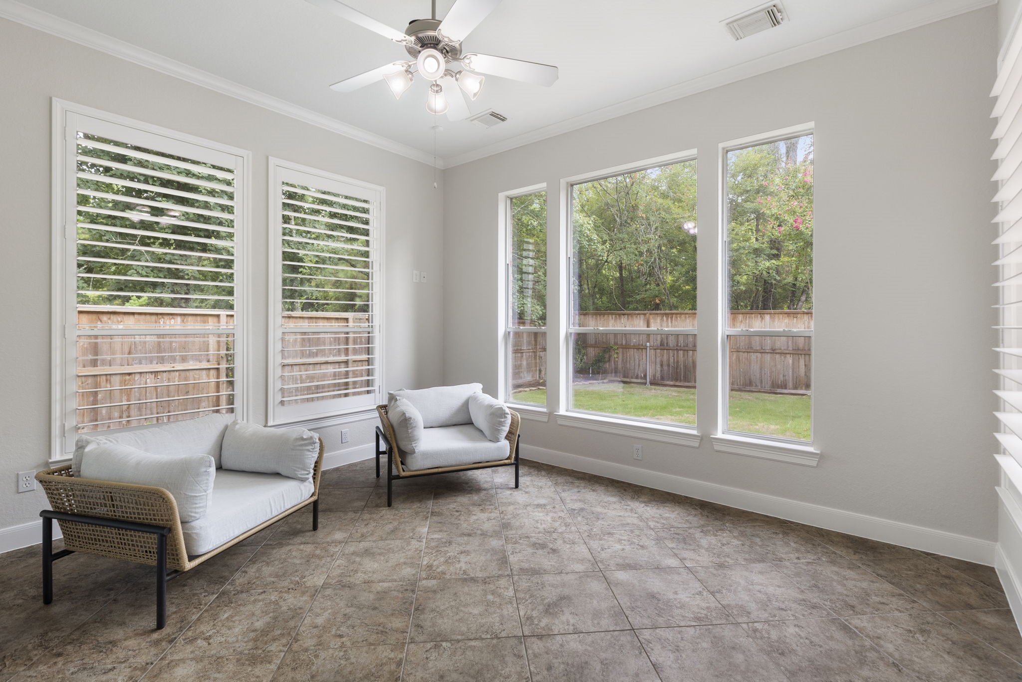 6 Skipwith Place Spring, TX 77382 - Photo 17 of 44 a living room with furniture and a large window with outer view