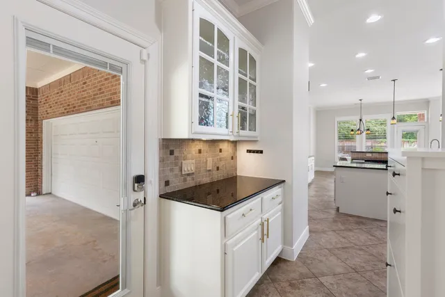 a kitchen that has a cabinets and a stove