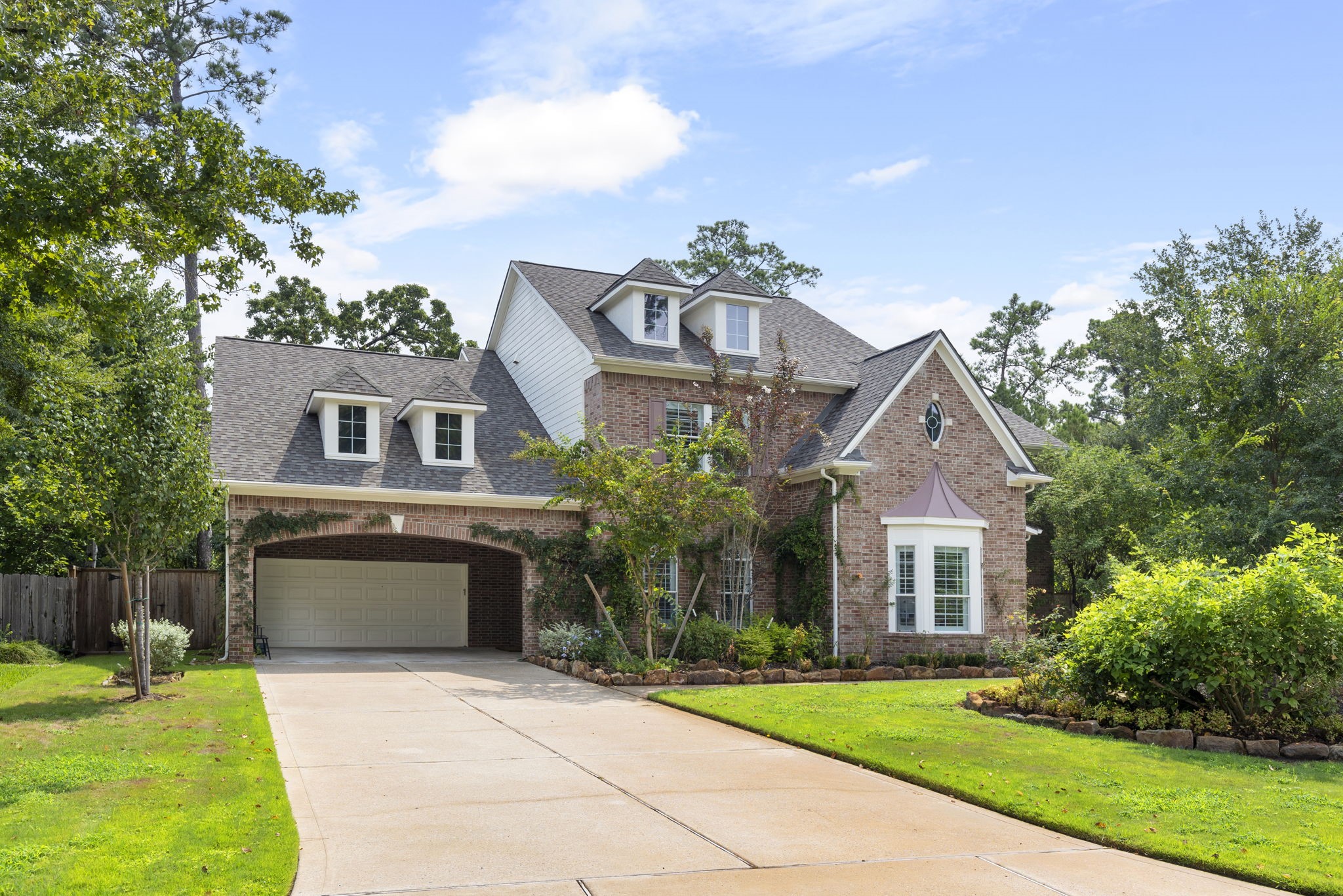 6 Skipwith Place Spring, TX 77382 - Photo 2 of 44 a front view of a house with a yard