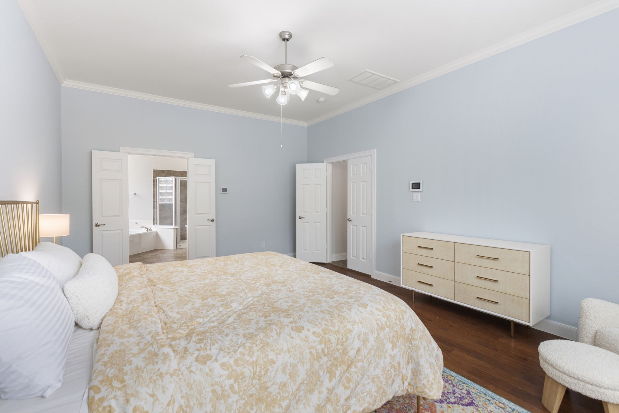 6 Skipwith Place Spring, TX 77382 - Photo 22 of 44 a bedroom with a bed and a dresser