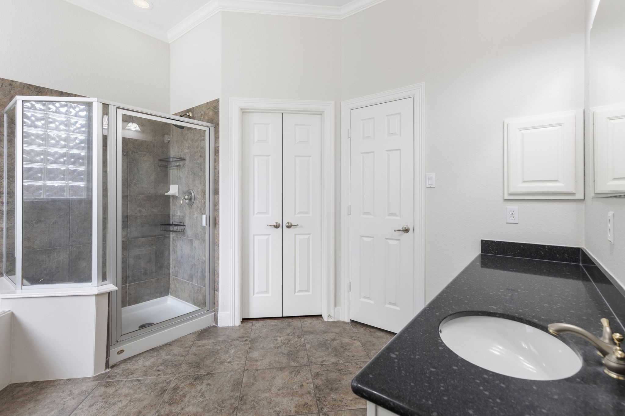 6 Skipwith Place Spring, TX 77382 - Photo 24 of 44 a bathroom with a sink and a mirror