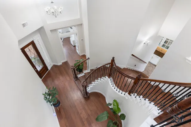 a view of staircase with white walls