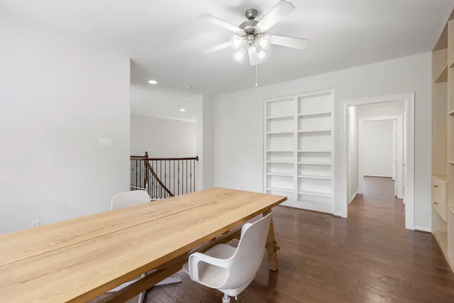 a room with a bed and a chandelier