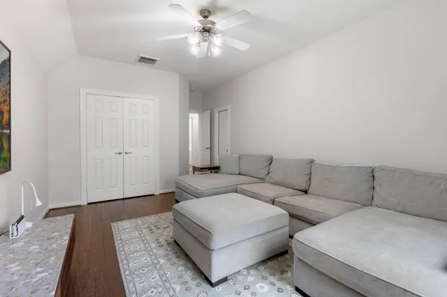 a living room with furniture and a rug
