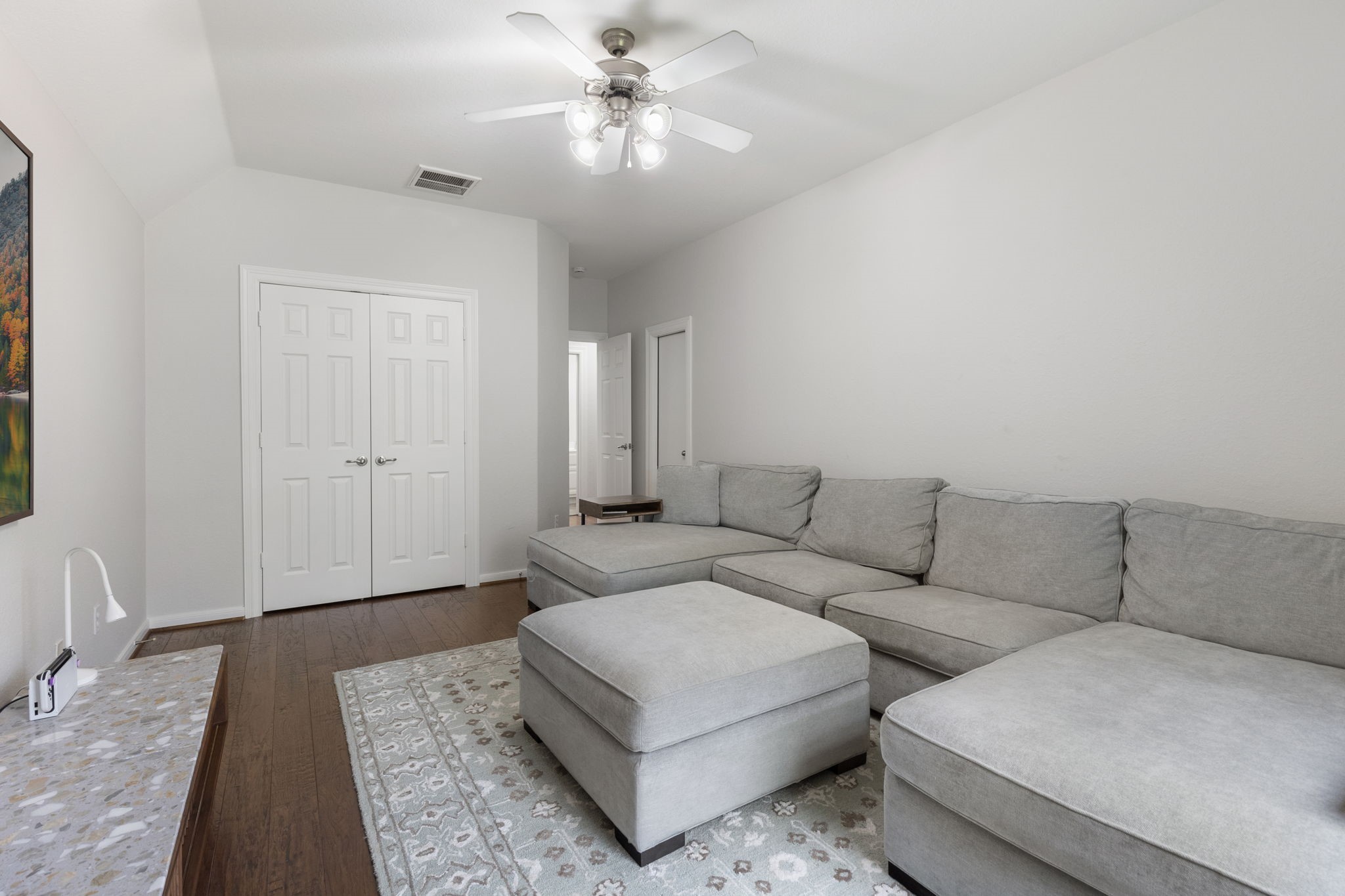6 Skipwith Place Spring, TX 77382 - Photo 31 of 44 a living room with furniture and a rug