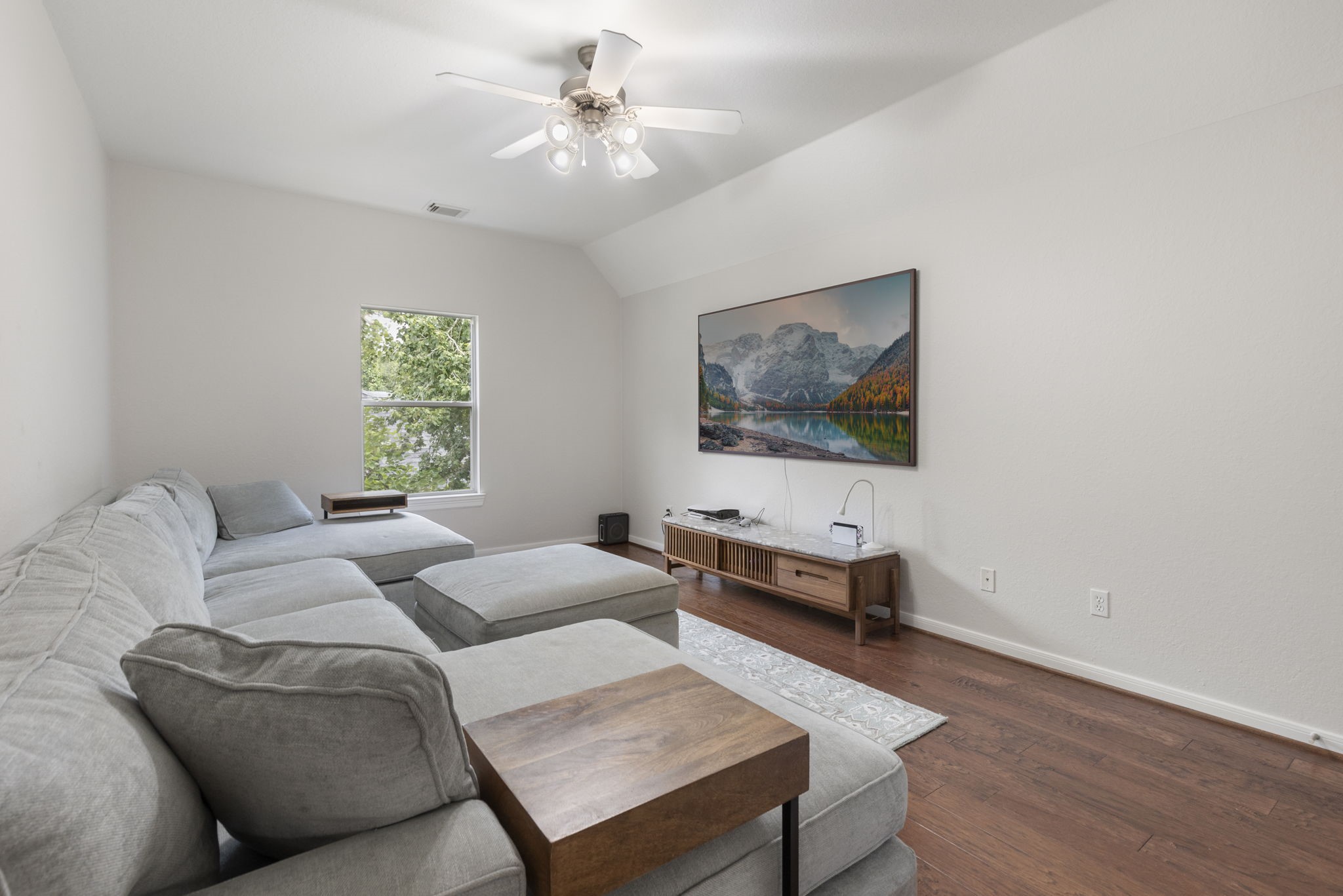 6 Skipwith Place Spring, TX 77382 - Photo 32 of 44 a living room with furniture and a flat screen tv