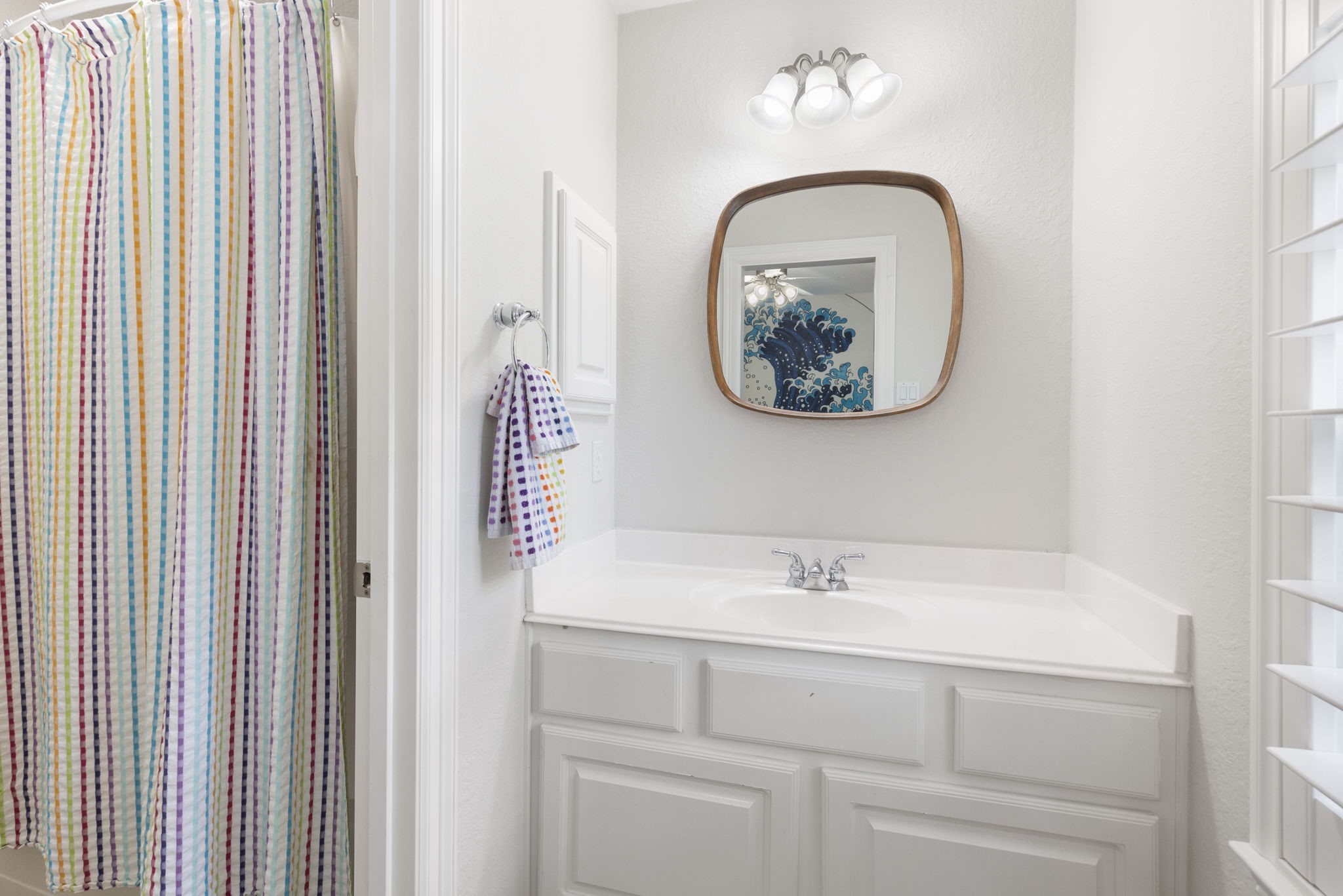 6 Skipwith Place Spring, TX 77382 - Photo 38 of 44 a bathroom with a sink and a mirror