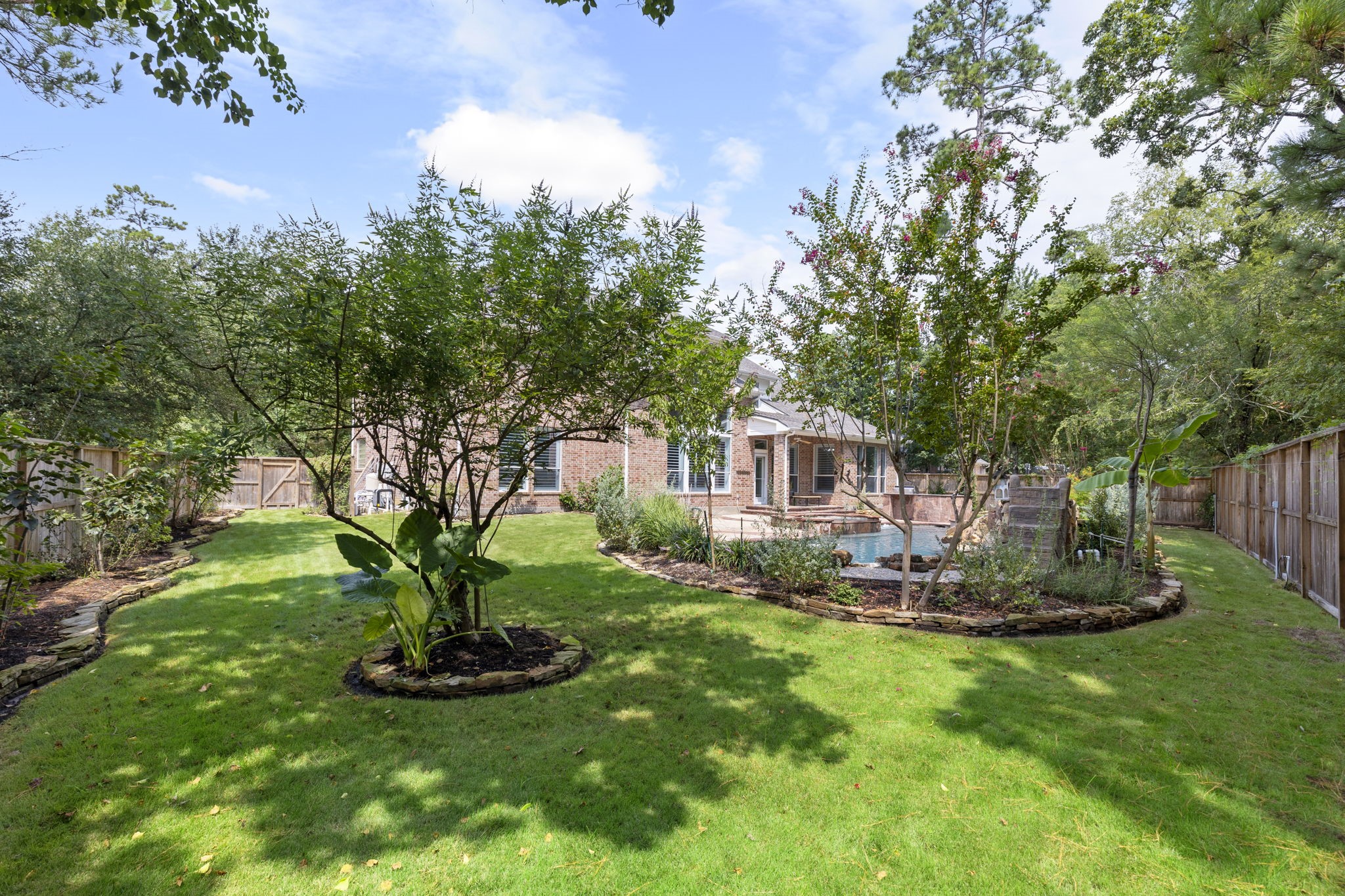 6 Skipwith Place Spring, TX 77382 - Photo 39 of 44 a view of a house with backyard sitting area and garden