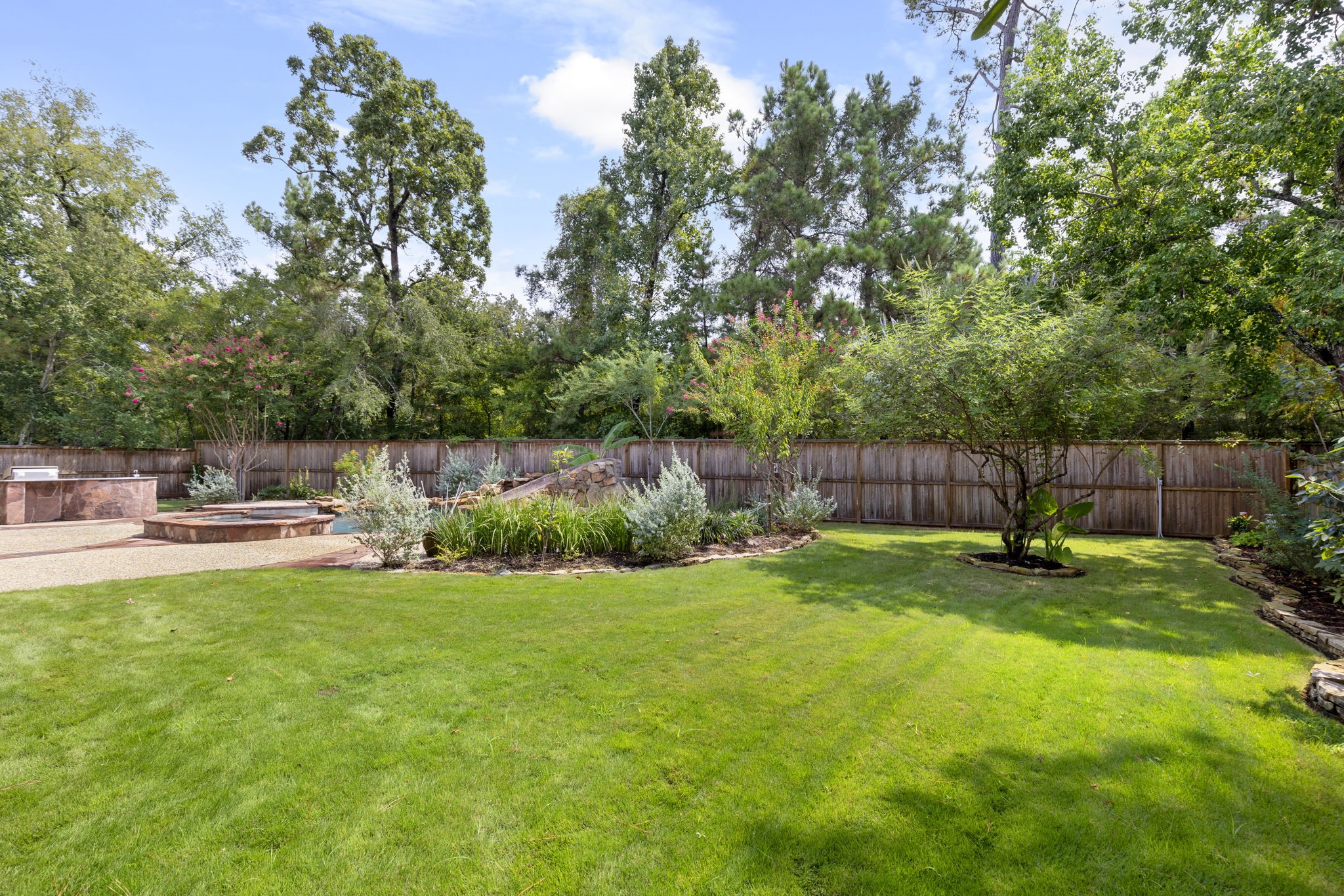6 Skipwith Place Spring, TX 77382 - Photo 40 of 44 a view of a garden with an outdoor space
