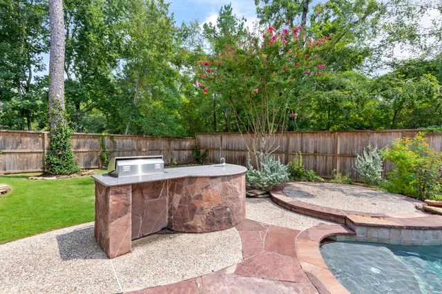 a view of a backyard with a sitting area