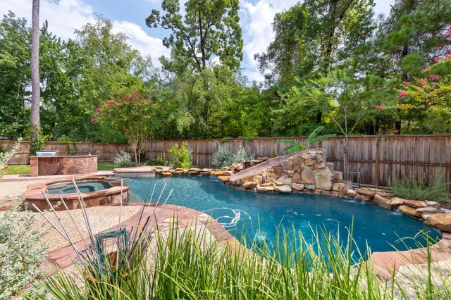 a view of swimming pool with a patio