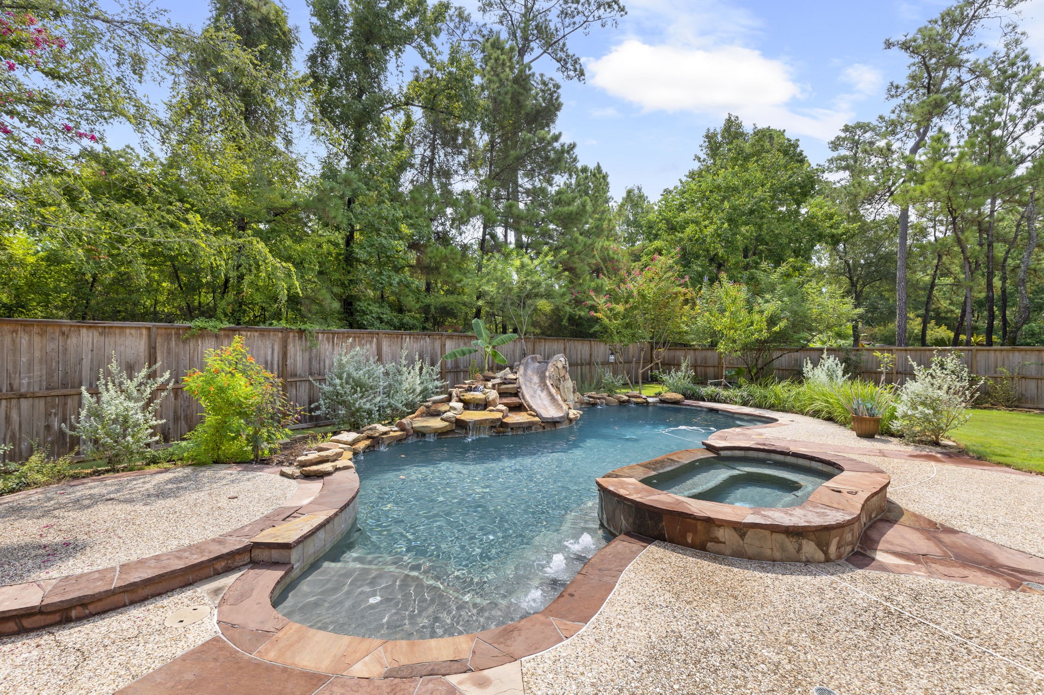 6 Skipwith Place Spring, TX 77382 - Photo 42 of 44 a view of a backyard with plants and outdoor seating
