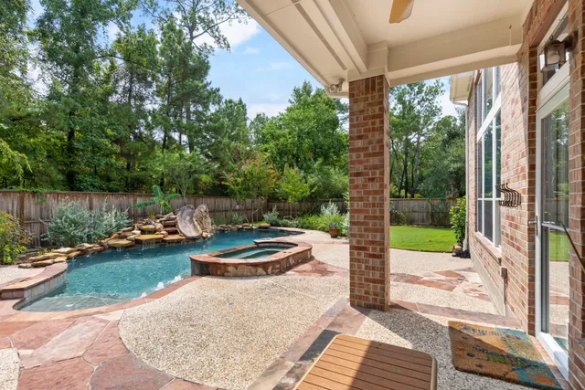 a view of a patio with chair and tables