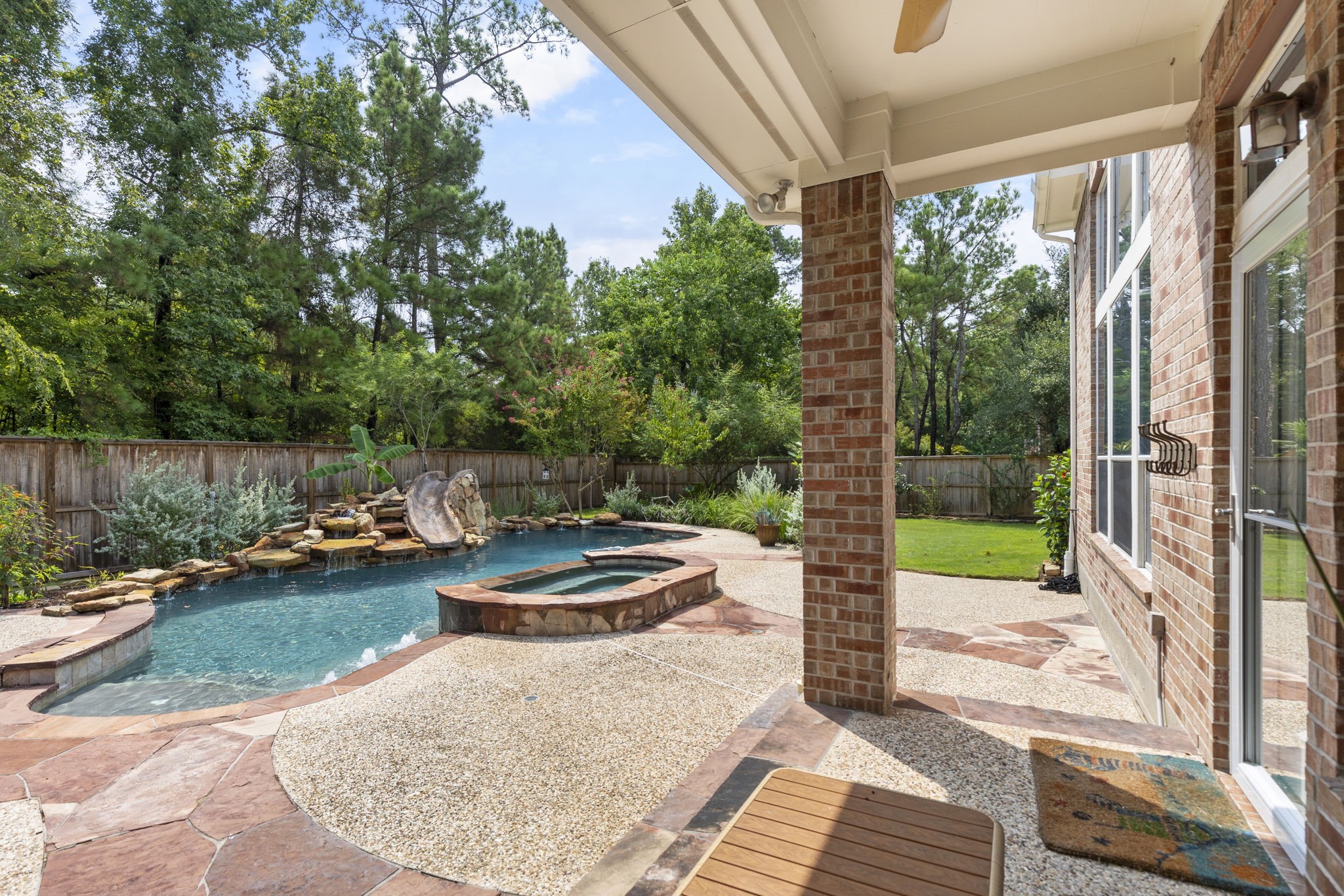 6 Skipwith Place Spring, TX 77382 - Photo 43 of 44 a view of a patio with chair and tables