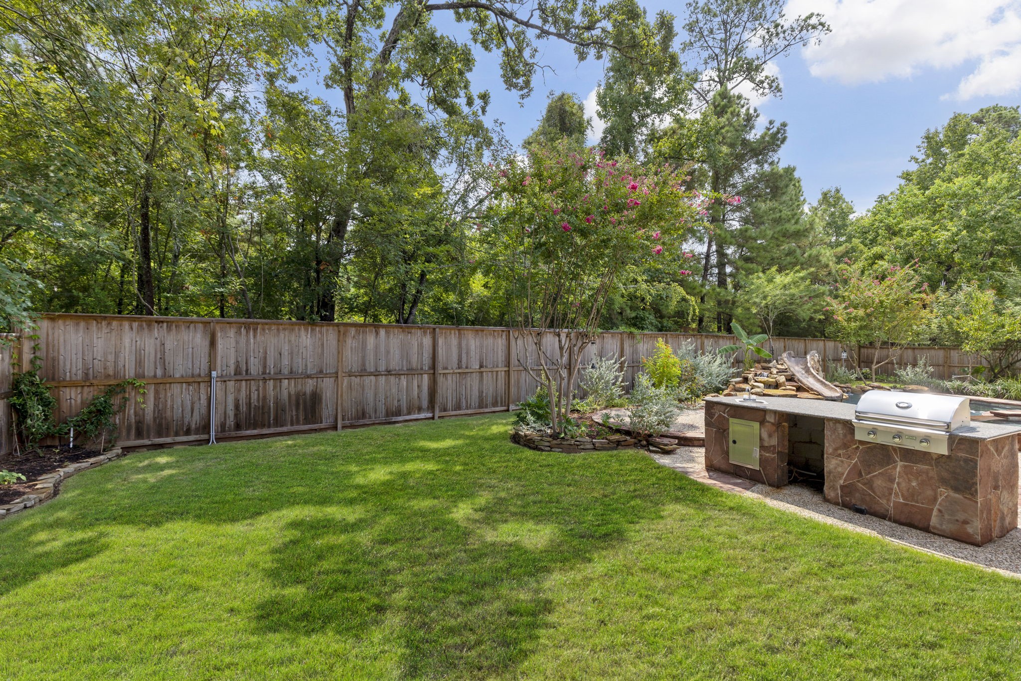 6 Skipwith Place Spring, TX 77382 - Photo 5 of 44 a view of a backyard with seating area and green space