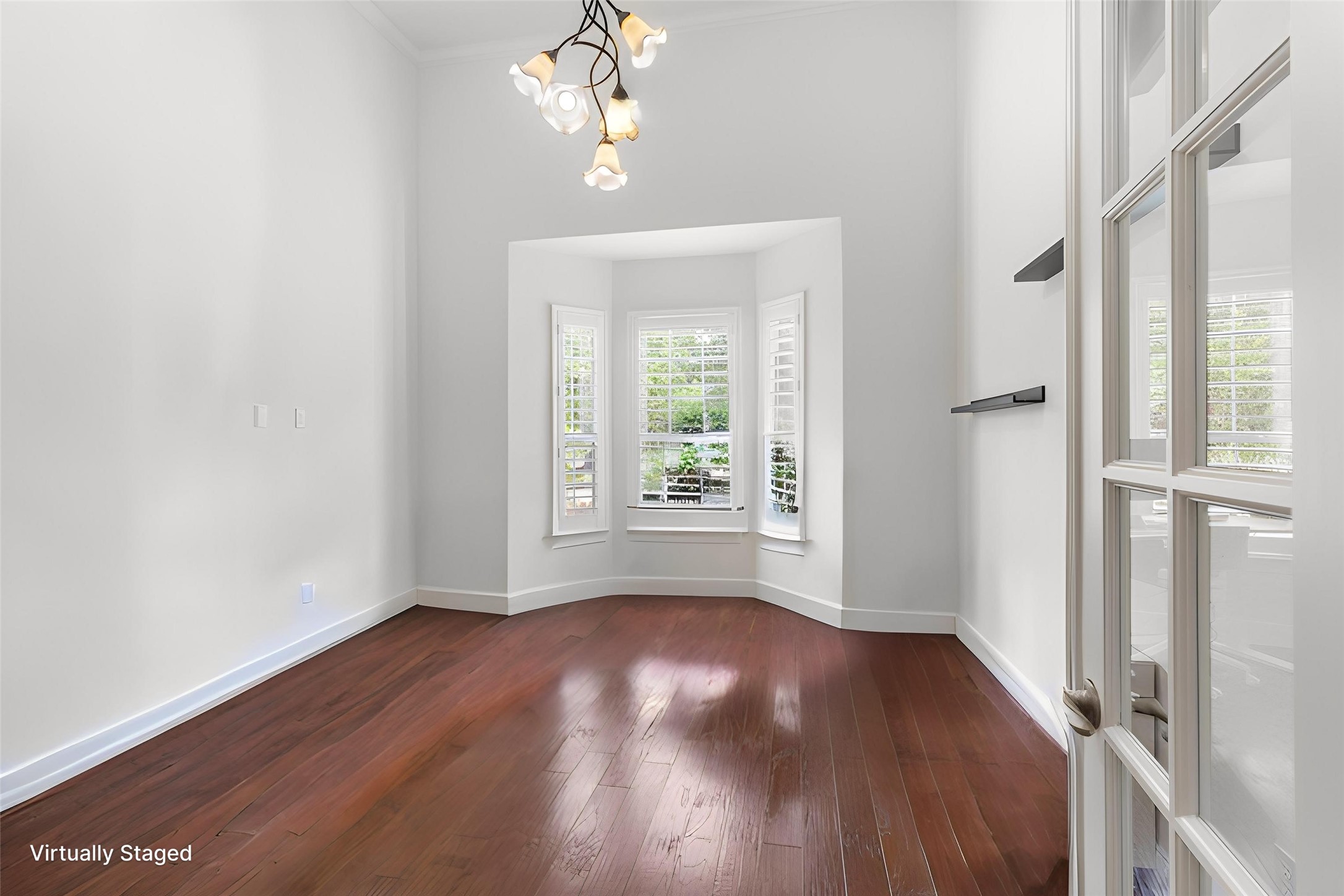6 Skipwith Place Spring, TX 77382 - Photo 8 of 44 wooden floor in an empty room with a window